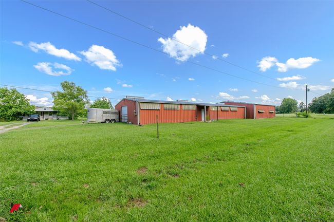314 feet of road frontage looking toward the barn and doublewide. | Image 4