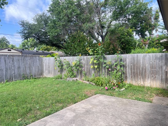 Fenced backyard featuring a patio area | Image 11