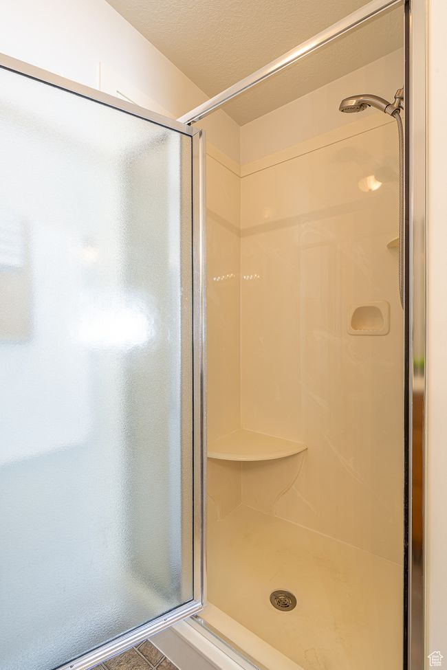Bathroom with a stall shower | Image 20