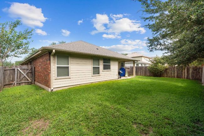 Rear view of property featuring a fenced backyard, and brick siding | Image 27