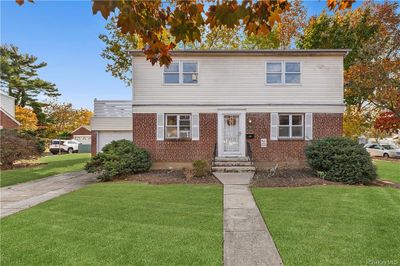 View of front of home featuring a garage and a front lawn | Image 1