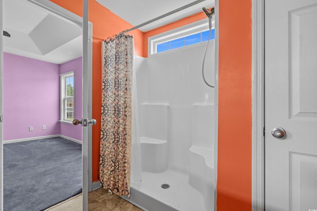 Full bathroom featuring curtained shower and baseboards | Image 31