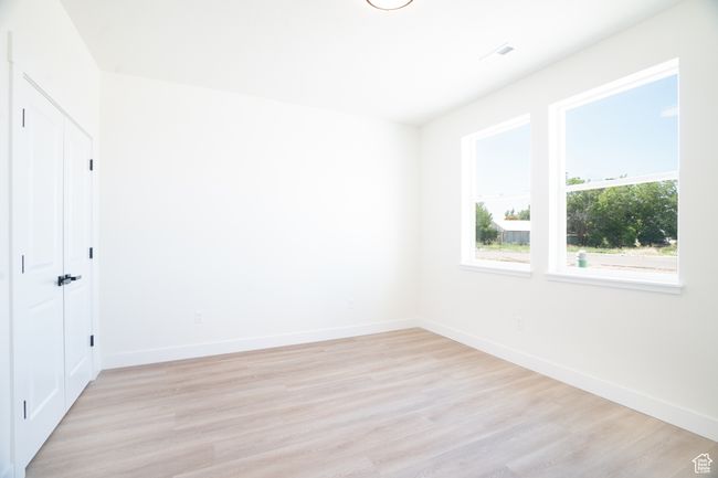 Unfurnished room featuring light wood finished floors and baseboards | Image 19