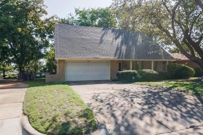 View of front of home featuring a garage and a front lawn | Image 1