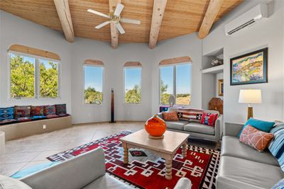 Living Room with Viga Ceilings and Lots of Windows | Image 3