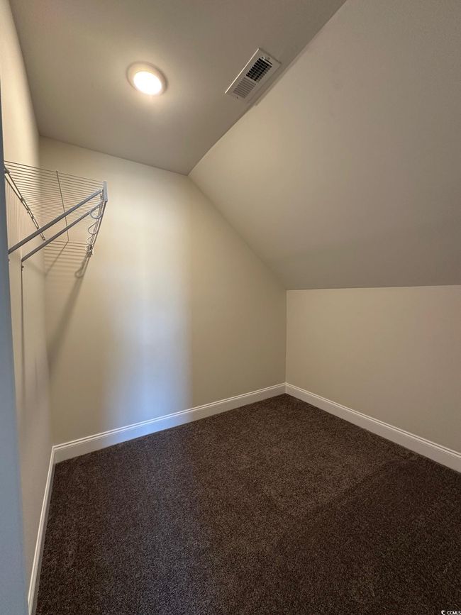 Additional living space featuring visible vents, baseboards, lofted ceiling, and carpet floors | Image 23