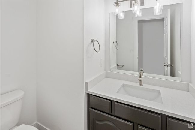 Bathroom with toilet and vanity | Image 16
