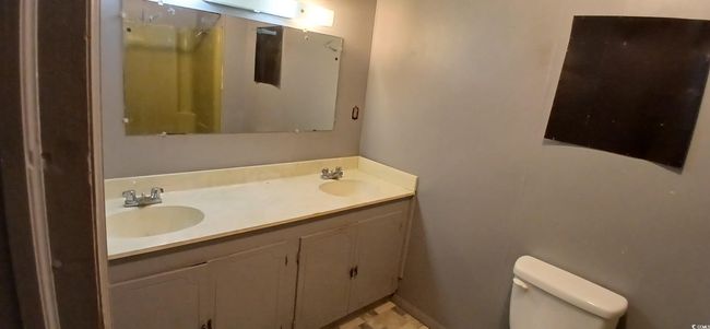 Bathroom with double vanity and toilet | Image 25