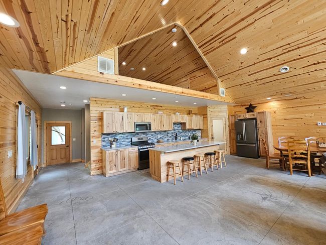 Kitchen area. Note loft above. | Image 10