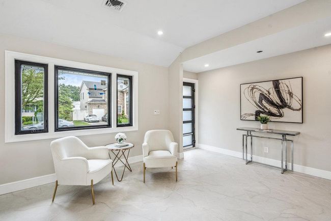 Living area featuring vaulted ceiling, recessed lighting | Image 14