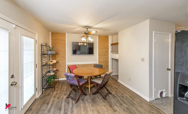 Dining room featuring baseboards, ceiling fan, and wood finished floors | Image 11