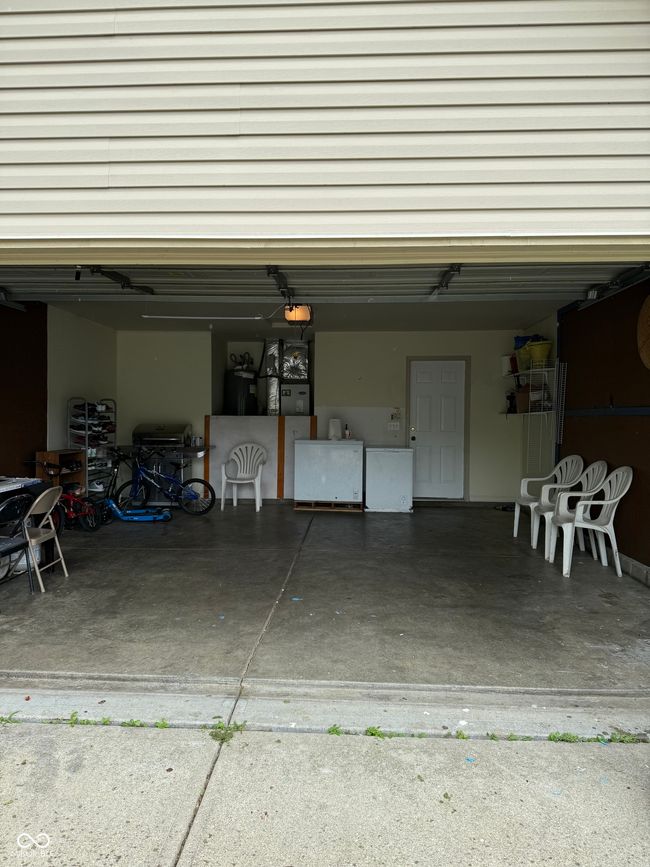 garage featuring a garage door opener | Image 14