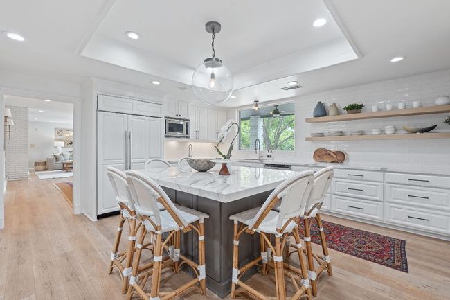 Chef's kitchen perfect with view of the pool | Image 12