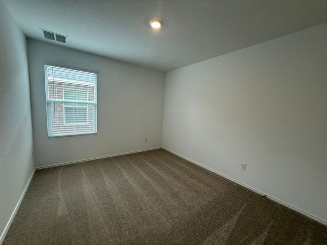 Unfurnished room with dark carpet and baseboards | Image 25
