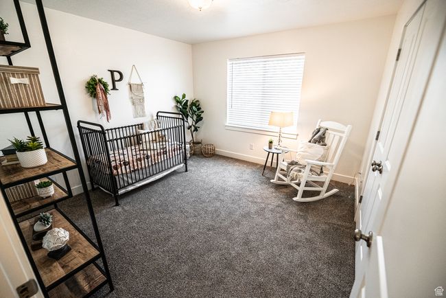 Bedroom with carpet flooring and baseboards | Image 9