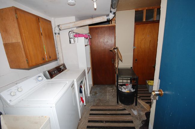 Clothes washing area with washing machine and dryer | Image 20