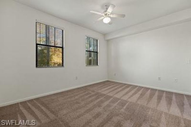 Empty room featuring ceiling fan, baseboards, and carpet | Image 17