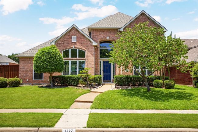 View of front of property with brick siding and a shingled roof | Image 37
