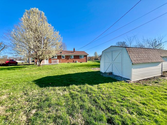 view of yard featuring an outdoor structure and a storage unit | Image 25
