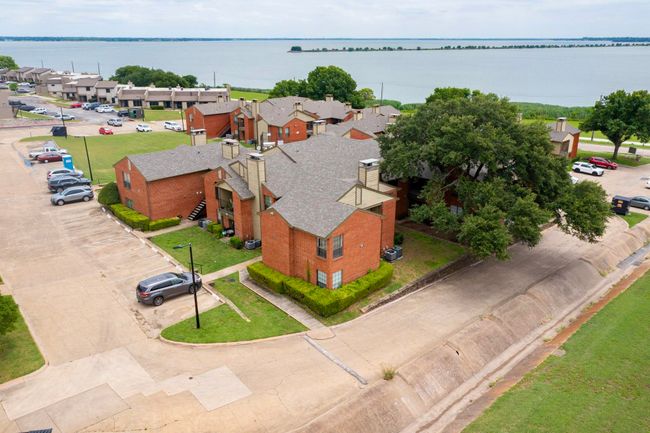 Aerial perspective of suburban area featuring a nearby body of water | Image 33