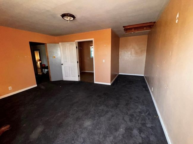 Unfurnished bedroom featuring baseboards and carpet flooring | Image 8