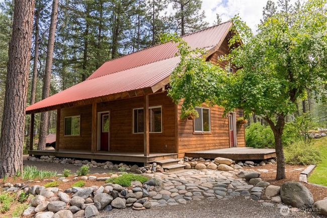 Gravel driveway with ample parking space. Room to add garage or storage shed if desired | Image 9