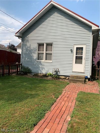 Rear view of house featuring a yard | Image 3