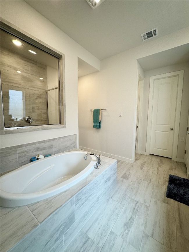 Bathroom with a bath and baseboards | Image 19