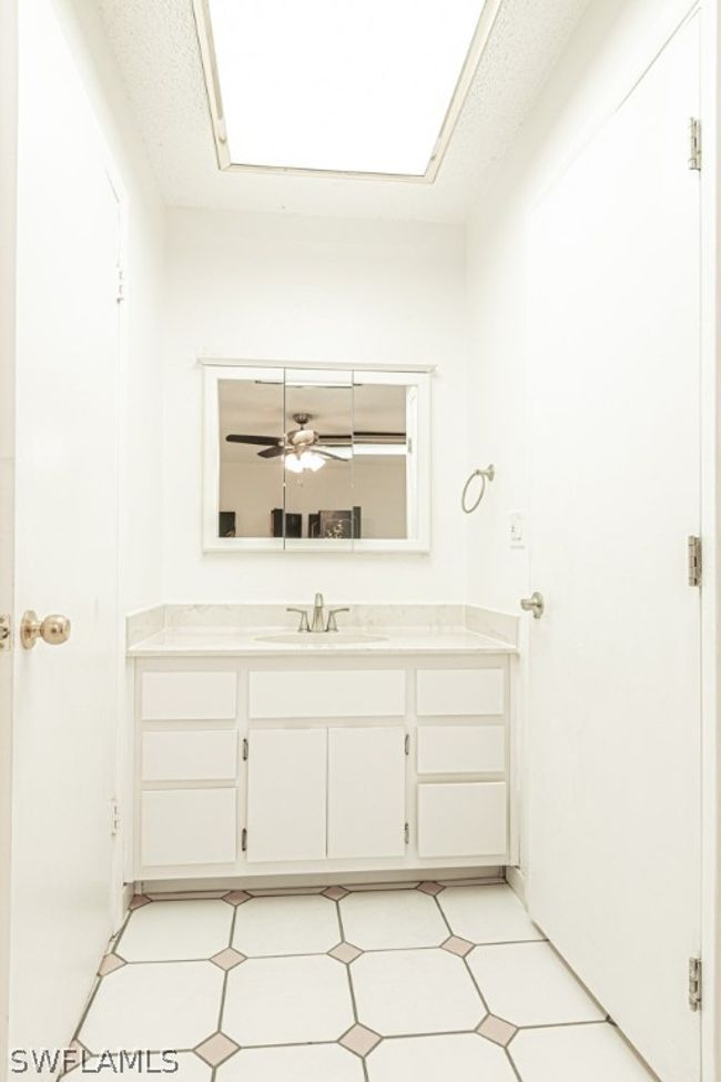 Bathroom featuring tile flooring, and oversized vanity | Image 19