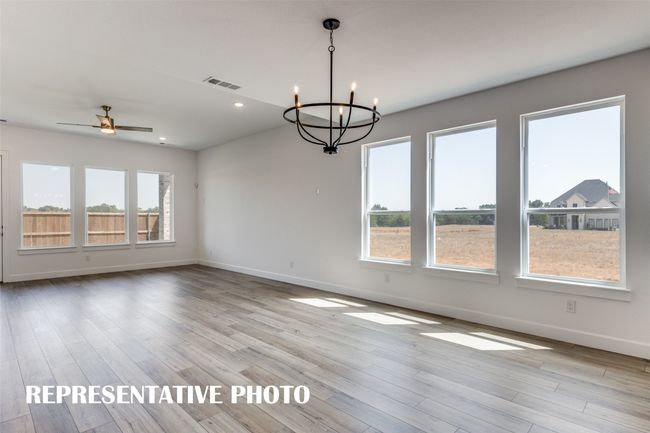 This beautiful light filled dining room is the perfect place for grand dinner parties or cozy family meals. REPRESENTATIVE PHOTO | Image 8