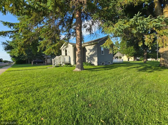 Mature trees protect the home while offering some shade and privacy. | Image 24