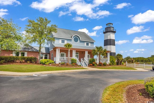 View of front of home featuring fence, a front yard, and covered porch | Image 34