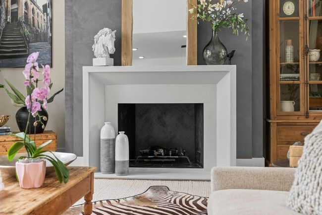Fireplace wall treatment adds subtle dynamic to the family room. | Image 10