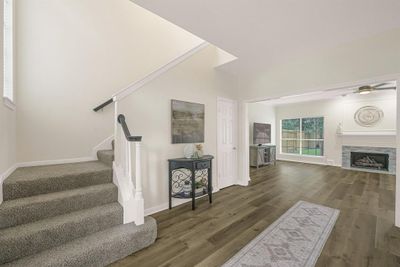 Bright and spacious foyer, featuring a modern open layout with a seamless flow into the living areas. | Image 2