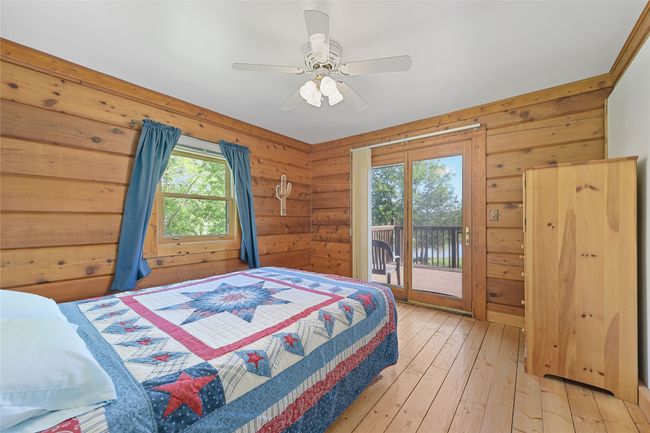 Main Level Guest Bedroom with door to Deck. | Image 16