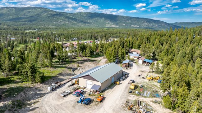 Aerial view of a heavily wooded area and mountains | Image 93