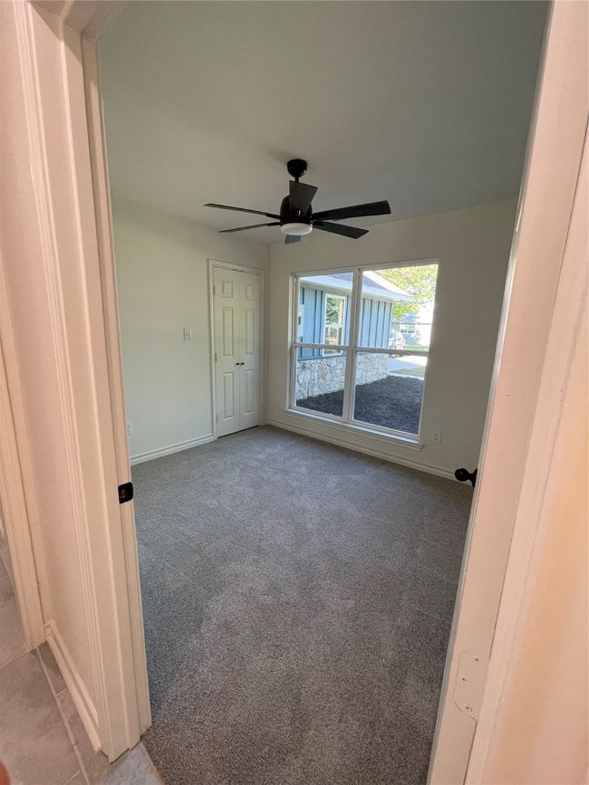 3rd Bedroom or Office featuring carpet, & ceiling fan. | Image 16