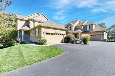 View of front of home with a garage and a front yard | Image 2