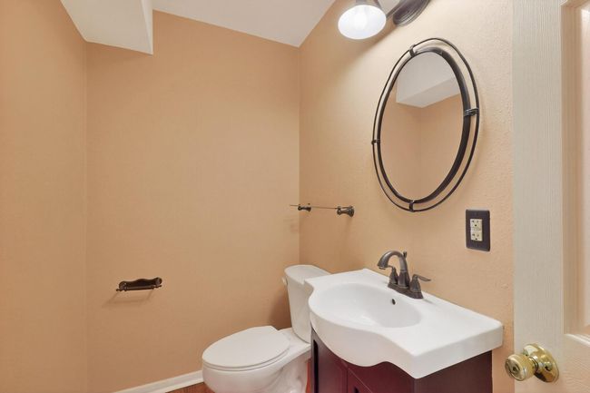 Bathroom featuring toilet and vanity | Image 31