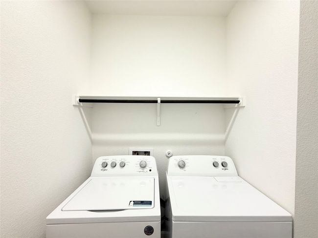 Laundry room featuring washing machine and dryer | Image 23