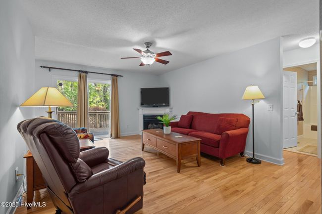 Relax in front of the fireplace, or birdwatch out sliding doors. | Image 13
