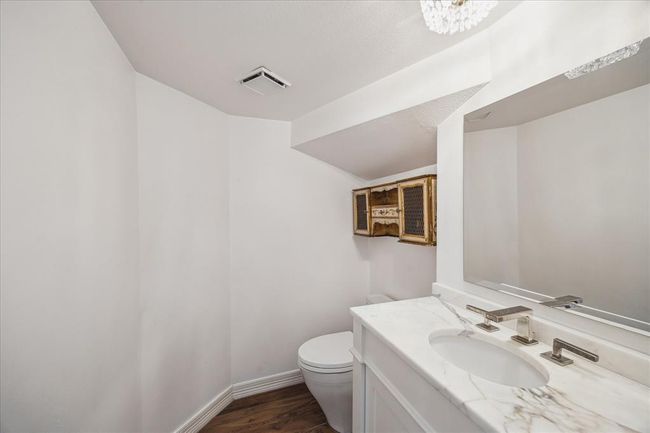 Downstairs 1/2 bath off the hallway with marble counters. | Image 15