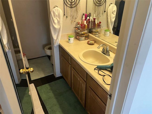 Bathroom featuring vanity and toilet | Image 17