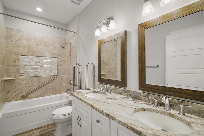 Guest/hall bath with dual sinks topped with Granite | Image 23