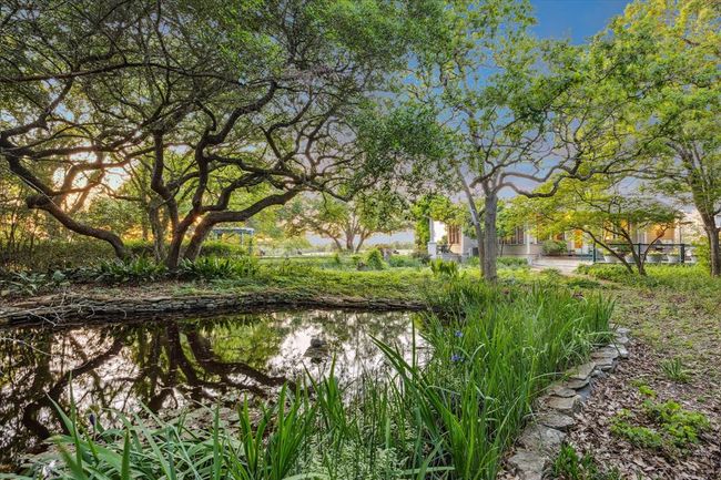 A view from the small pond to the back of the home. | Image 47