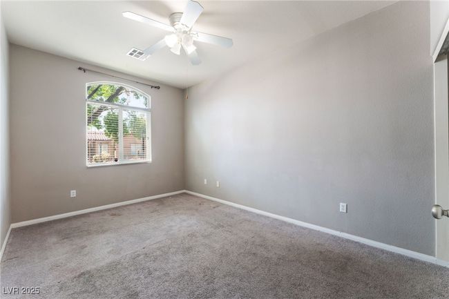 Carpeted empty room featuring a ceiling fan and baseboards | Image 41