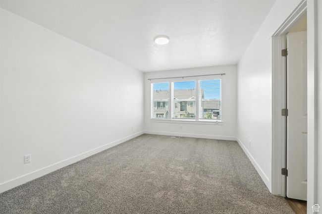 Carpeted spare room with baseboards | Image 18