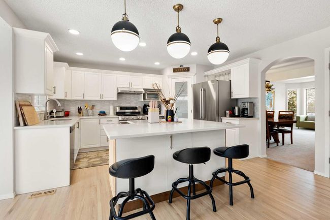 126 Strathridge Close Sw, Home with 7 bedrooms, 3 bathrooms and 4 parking in Calgary AB | Image 1