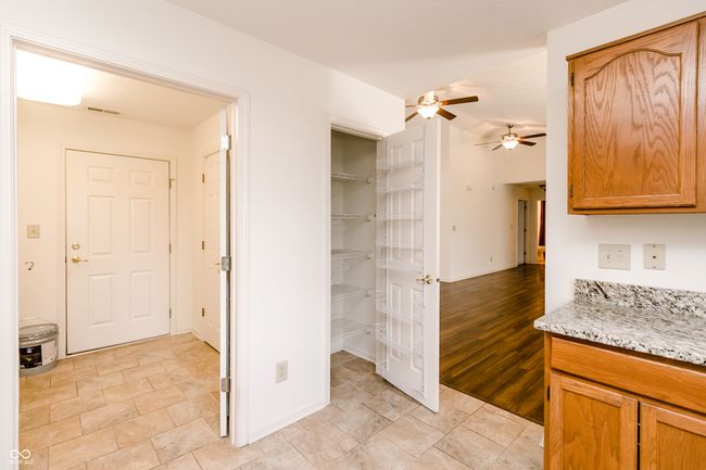 interior space with ceiling fan and visible vents | Image 12