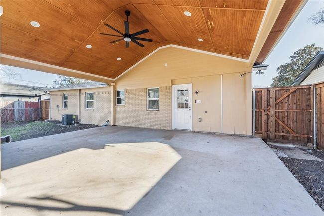 View of patio / terrace featuring a gate, central AC unit, fence, and ceiling fan | Image 5